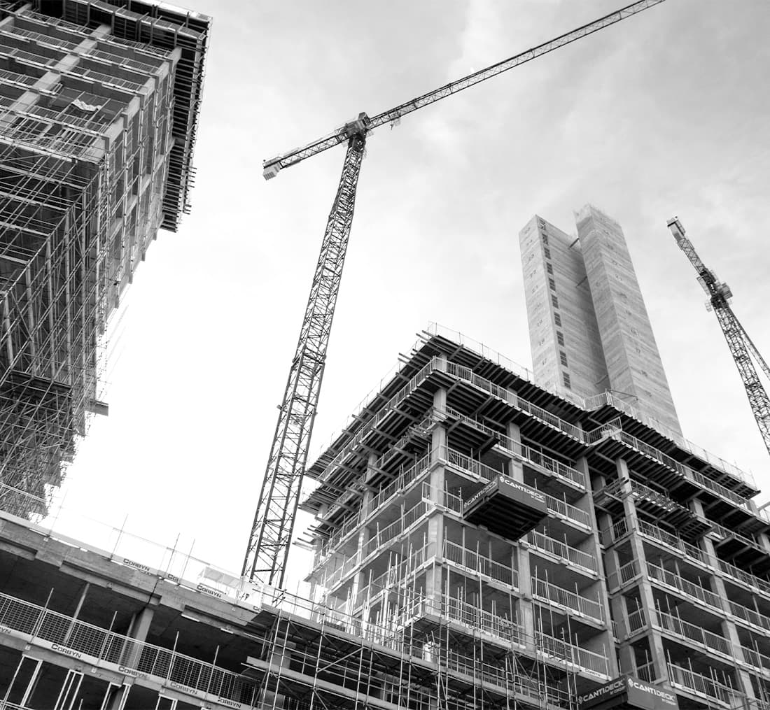 a construction site with a crane and scaffolding
