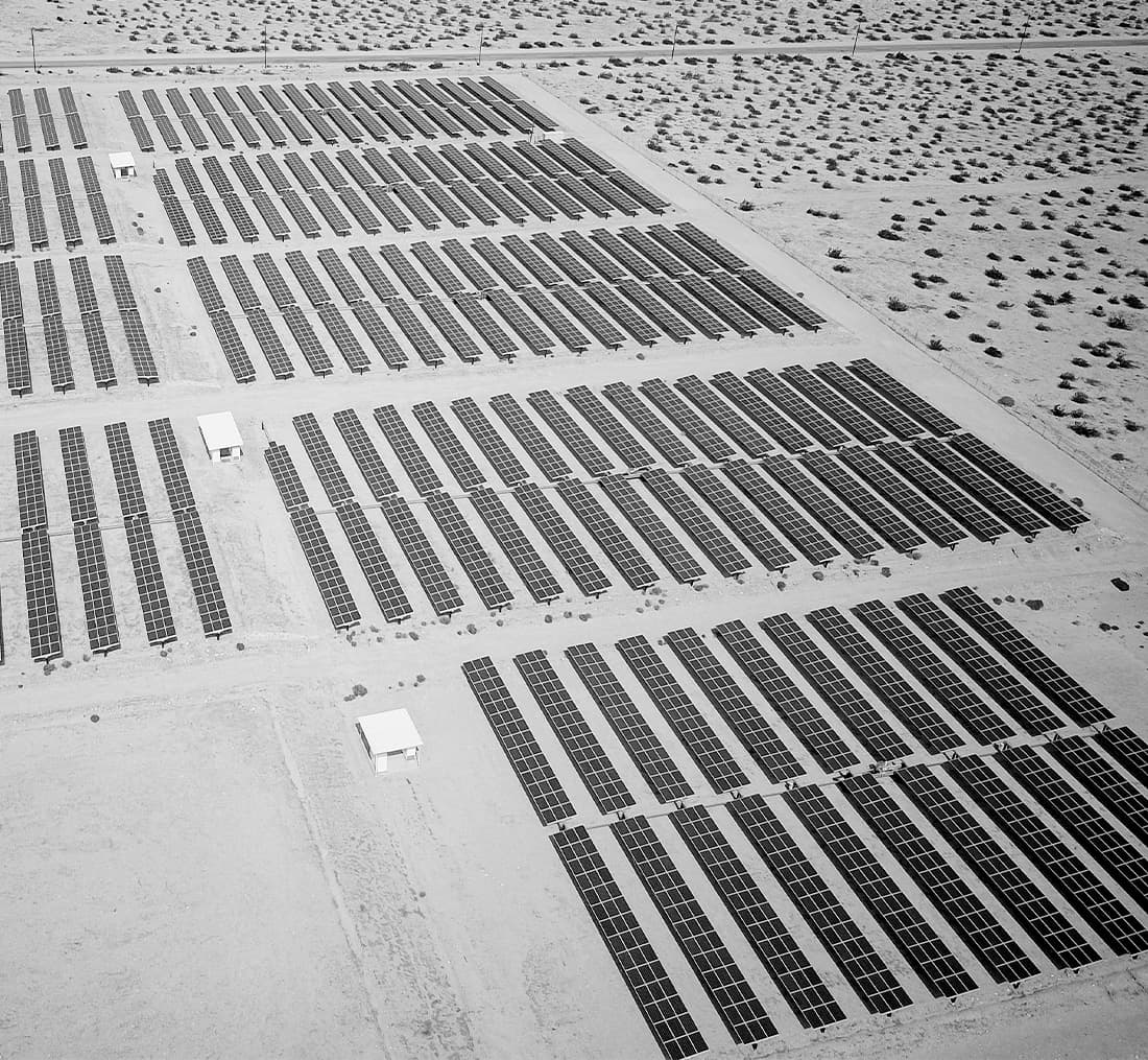 bird's eye view of solar panels in a deserted area