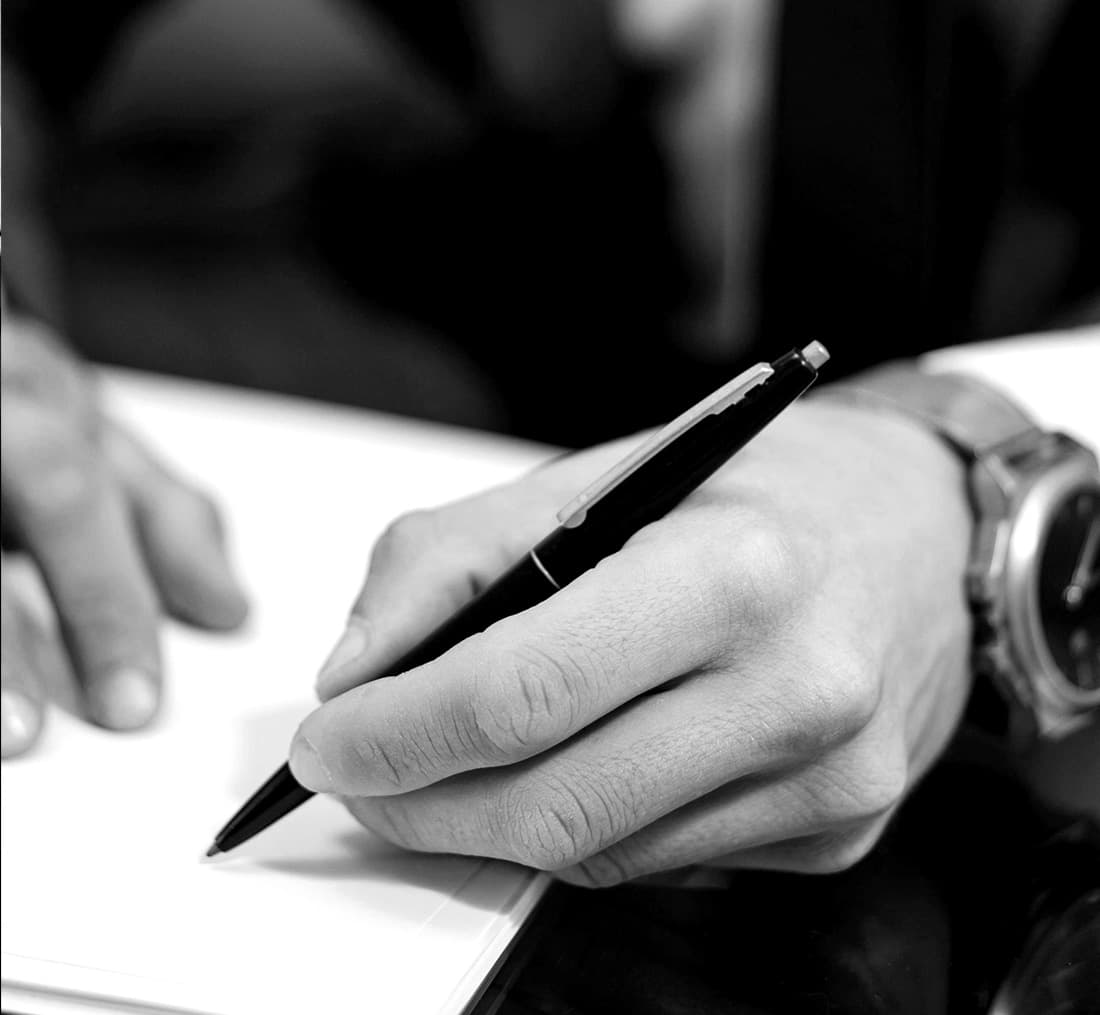 a person organising tenders and signing legal documents